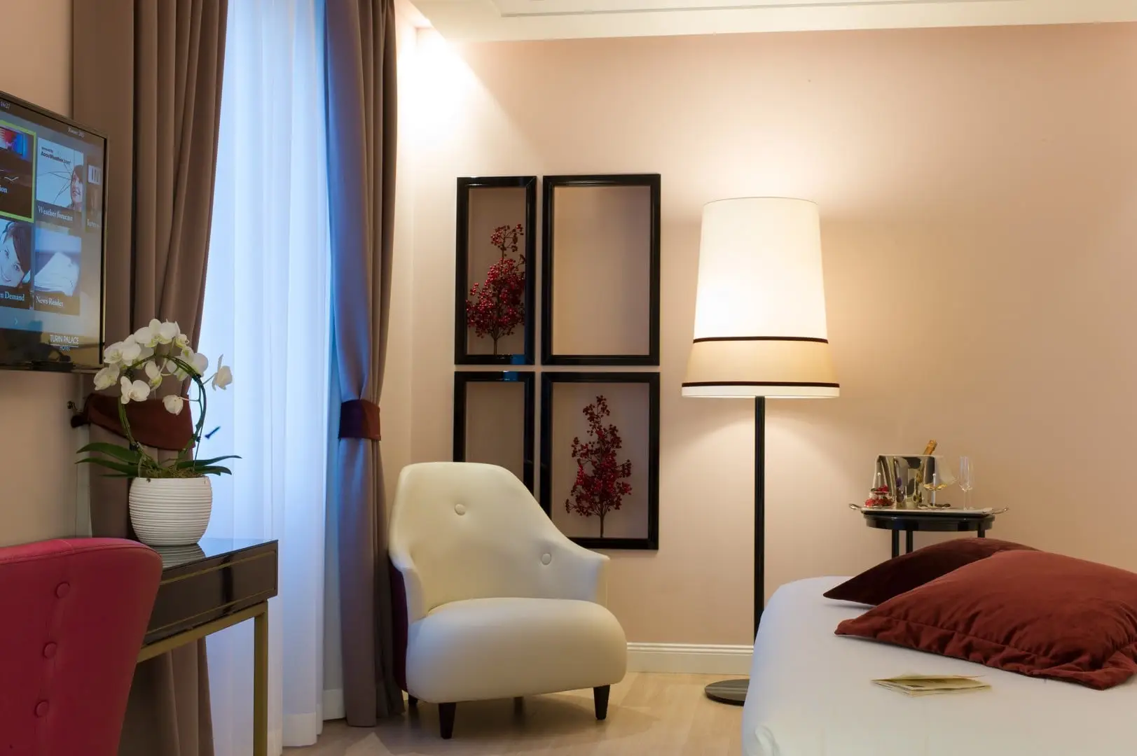 Turin Palace Hotel guest room with a seating corner