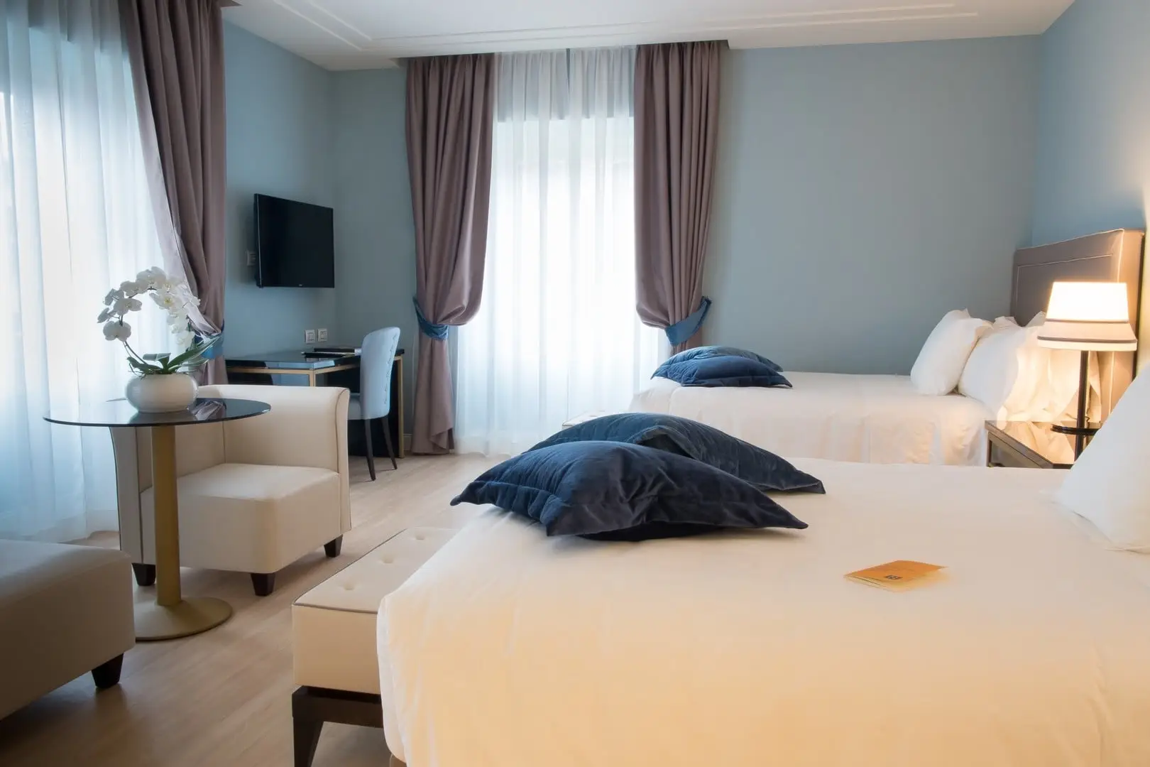 Twin beds in a Turin Palace Hotel guest room