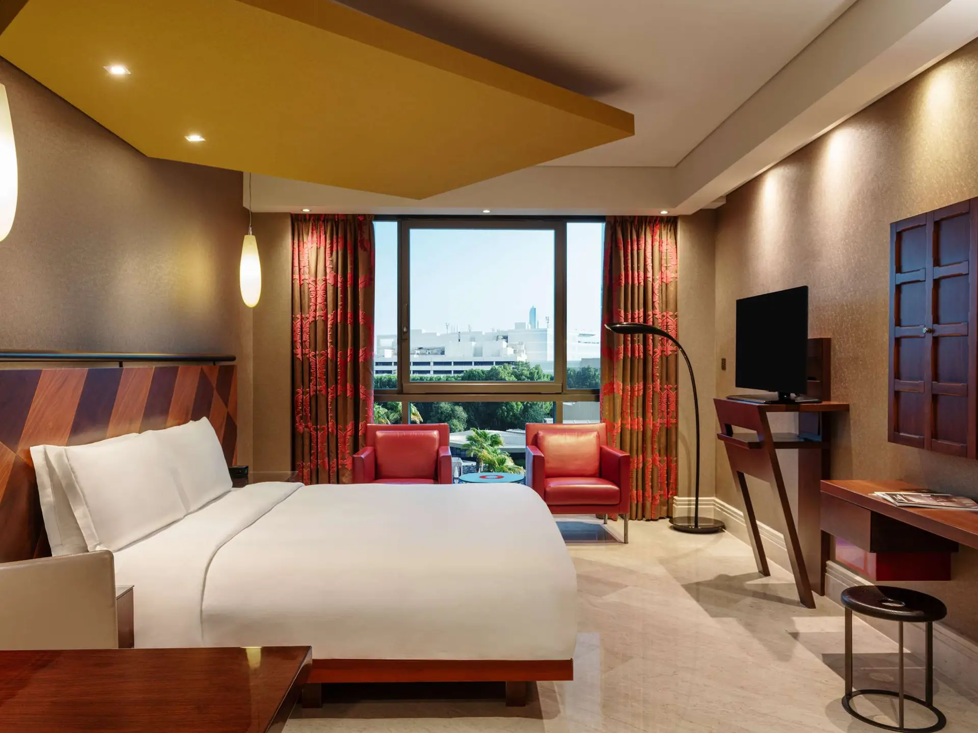 Guest room with seating area at the Creekside Hotel Dubai