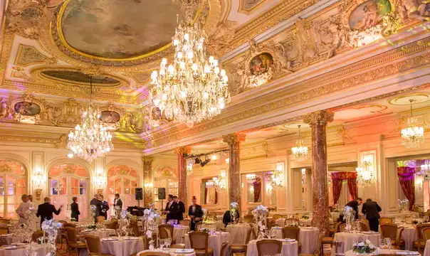 Ornate dining room with chandeliers at the Hôtel Hermitage Monte-Carlo