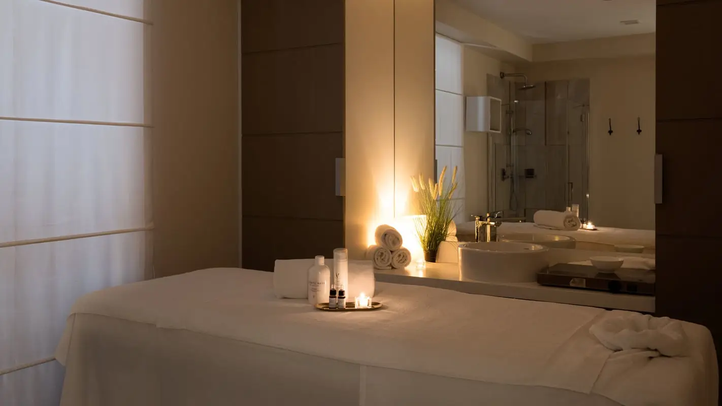 Candlelit spa treatment room at Turin Palace Hotel